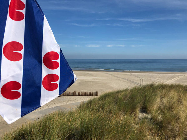 Frisian flag at the beach on Ameland island in Friesland The Netherlands