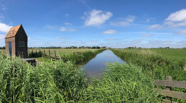 Small water pumping station near the town Gaastmeer in Friesland The Netherlands