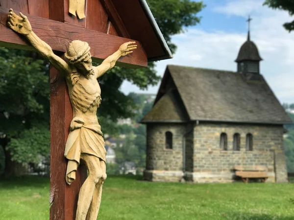 Jesus on a cross in front of a church in Monschau Germany