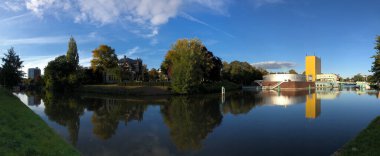 Panorama from the canal around the Groninger museum in Groningen The Netherlands clipart