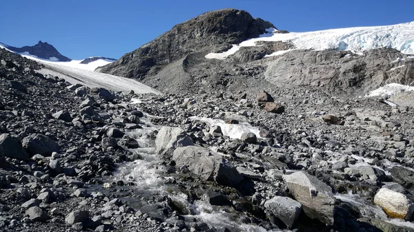 Rocks and snow at Jotunheimen National Park Norway