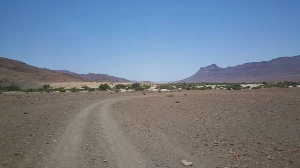 Gravel road through the desert in Namibia