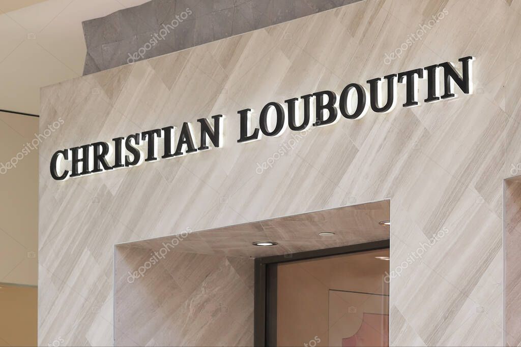 Honolulu, Hawaii - June 19, 2020: Exterior store front and name of French luxury designer Christian Louboutin at Waikiki International Marketplace.