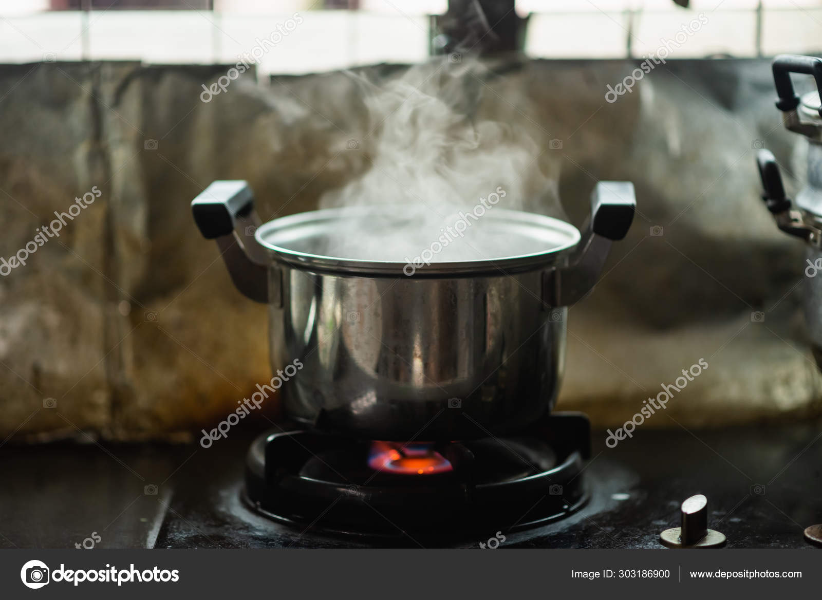 Steam Over Cooking Pot In Kitchen Stock Photo Image By Woraphon N Gmail Com 303186900