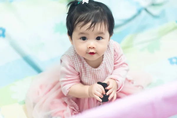 Portrait of cute baby in the bedroom — Stock Photo, Image