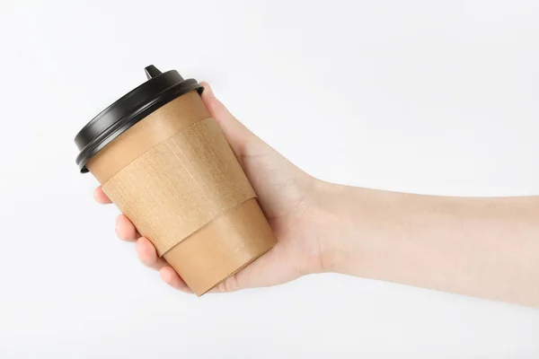 Hand Met Een Glas Met Koffie Een Achtergrond Licht Grijs — Stockfoto