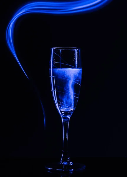 Glass Champagne Black Background Effect Drawing Blue Light Long Shutter — Stock Photo, Image