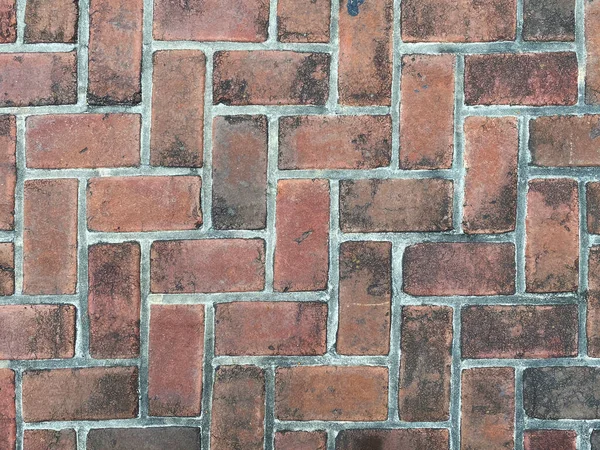 detailed close-up view old textured red black brick wall, rich colors and shadows suitable for website background marketing backgrounds backdrops architecture architectural layout design