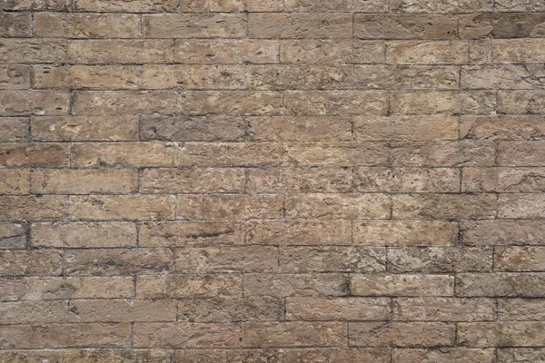Background of sand color brick wall texture