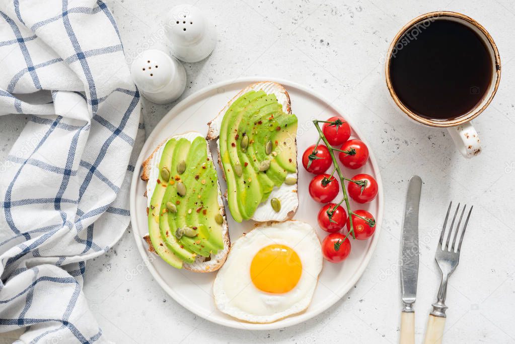 Avocado toast, egg and coffee for breakfast