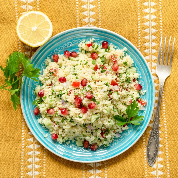 Couscous tabbouleh salad with pomegranate