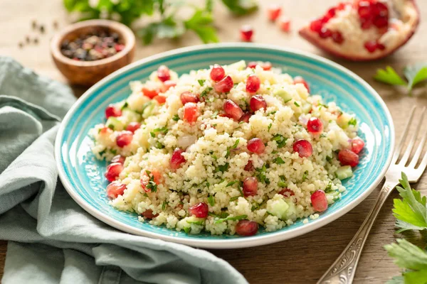 Healthy couscous salad tabbouleh with pomegranate — Stock Photo, Image