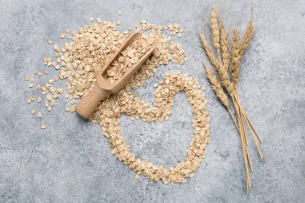 Avena laminada, copos de avena sobre hormigón —  Fotos de Stock