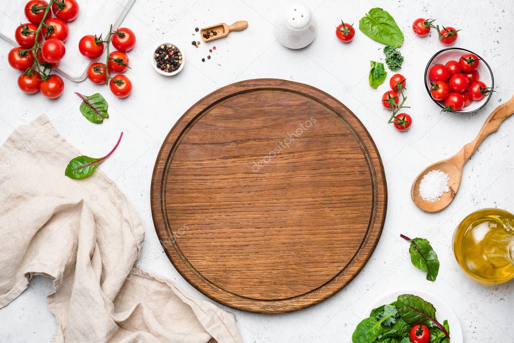 Wooden pizza board and pizza cooking ingredients