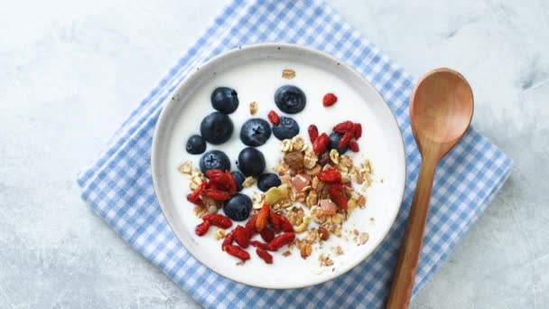 Stop Motion Healthy Breakfast Food Yogurt Bowl Blueberries Goji Berries — Stock Video