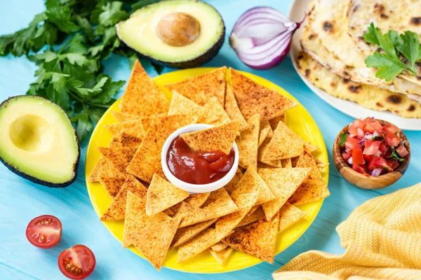 Mexican tortilla chips with paprika and tomato sauce — Stock Photo, Image
