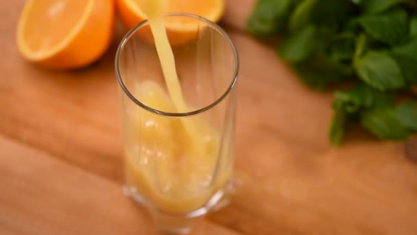 Pouring Orange Juice Glass Close View Slow Motion — Stock Video