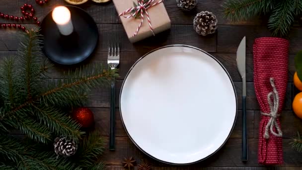 Christmas Table Setting Burning Candle Gift Box Overhead Shot — Stock Video