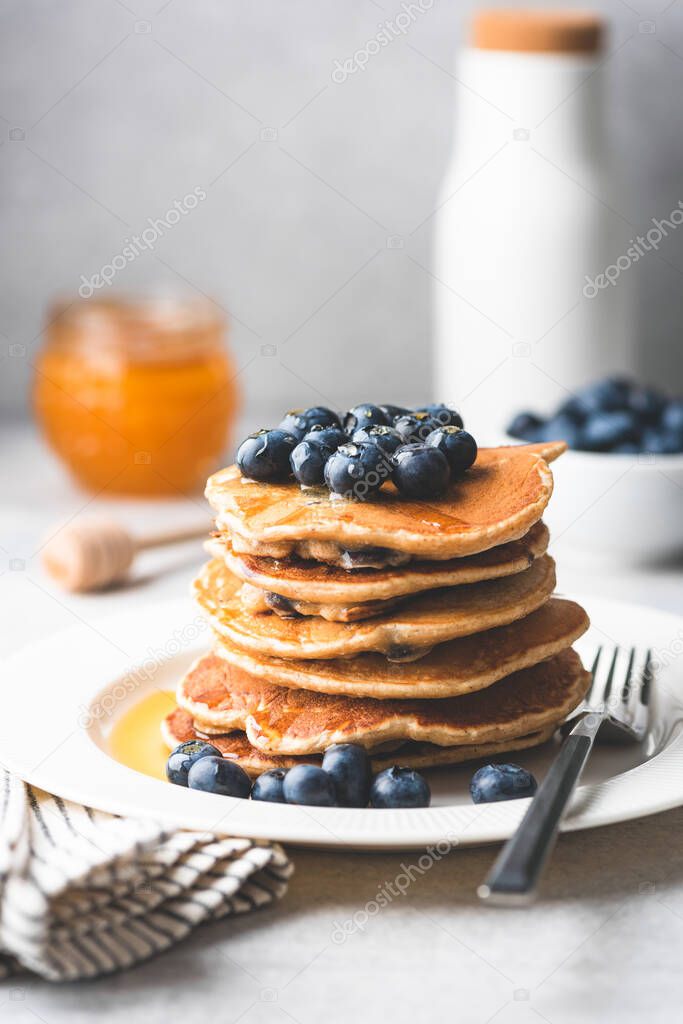 Pancakes with blueberries and honey