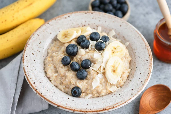 Oatmeal with blueberries, banana — Stock Photo, Image