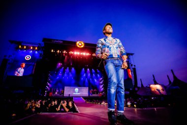 Pharrell Williams performing on stage during  music festival