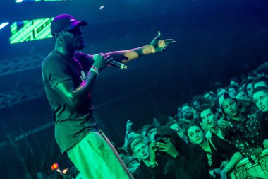 Stormzy performing on stage during  music festival 