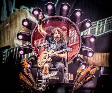Foo Fighters performing on stage during  music festival clipart