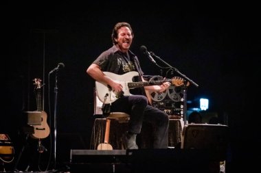 Eddie Vedder performing on stage during  music festival  clipart