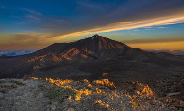 Teide volcano seen at sunrise from the top of Guajara mountain clipart