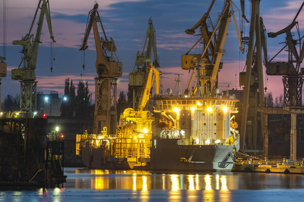 industrial areas, shipyard and port after sunset - Szczecin, Poland