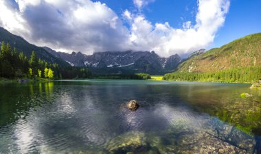 scenic view of mountain lake in Julian Alps in Italy clipart