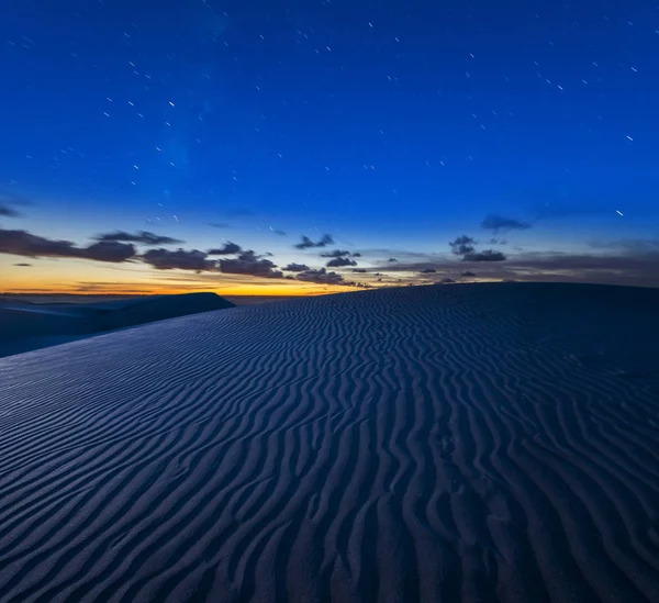 Starry night sky over desert, night landscape