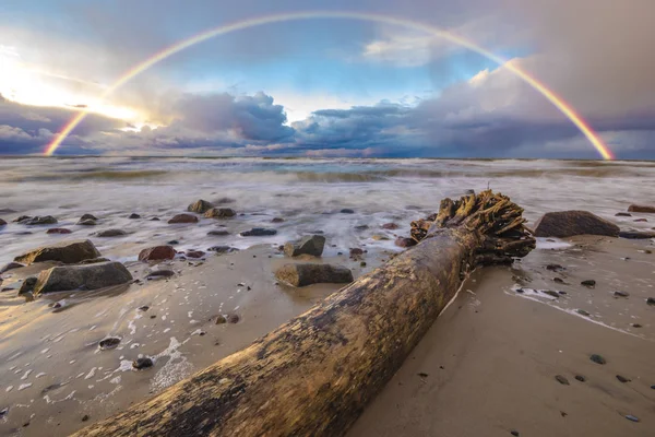 Beautiful colored storm clouds over the sea beach, rainbow — Stock Photo, Image