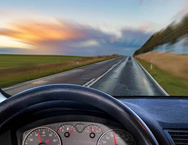 A view from behind the steering wheel of a car Royalty Free Stock Photos