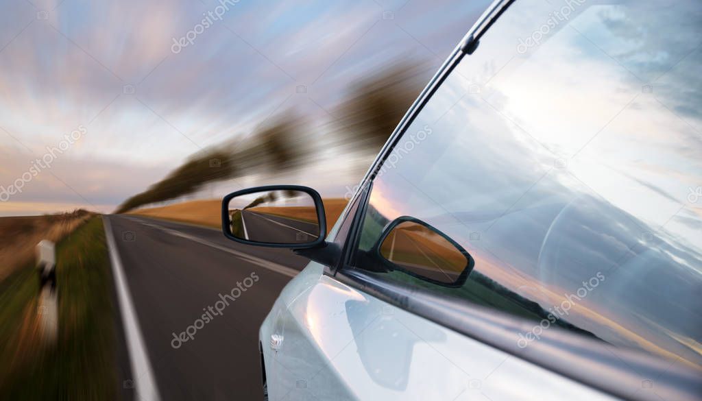 A view of a car passing by the road