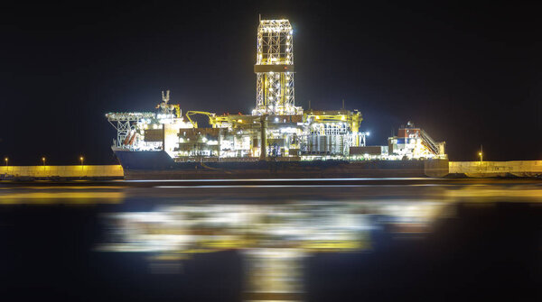 oil rig in the harbor at night