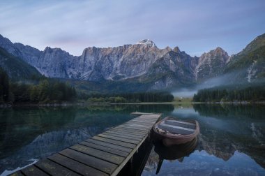 Mountain lake in the Julian Alps in Italy clipart