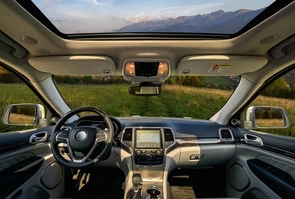 View from the interior of a modern SUV driving on the road in th — Stock Photo, Image