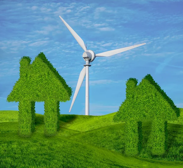 concept of green, ecological houses on a green meadow against the blue sky