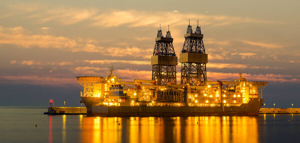 drilling platform on the sea at sunrise