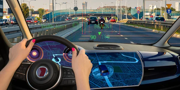 Woman driving a car equipped with active safety systems and HUD — Stock Photo, Image