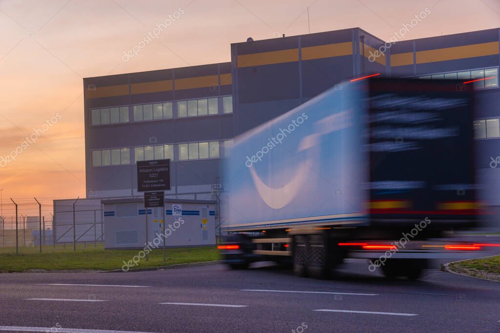 Truck trailer with Logo Amazon Prime entering the Amazon logistics center