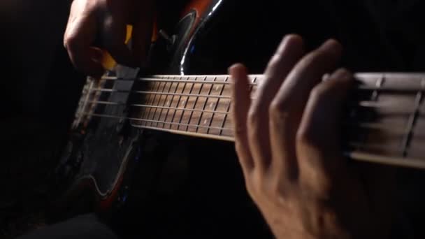 Musician Plays Bass Guitar Dark Background Closeup — Stock Video