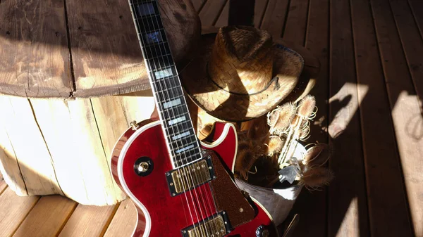 electric guitar on the wooden boards . Closeup , copy space