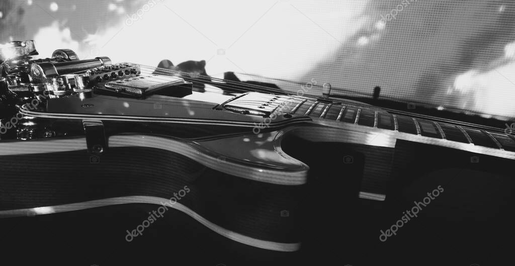 electric guitar closeup in the stage light . black and white