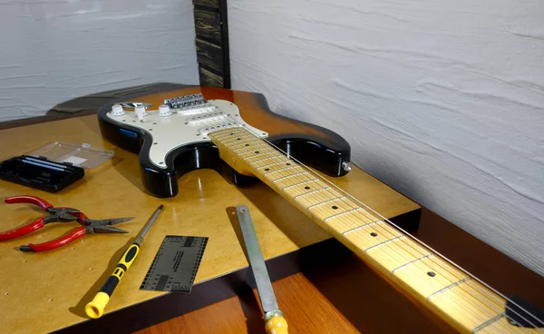 Repair electric guitar . Closeup