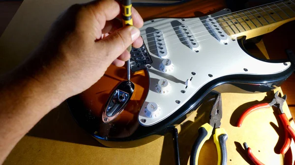 Repair electric guitar . closeup