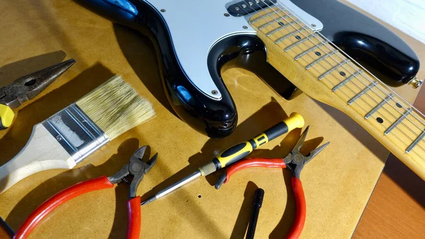 Repair electric guitar . closeup
