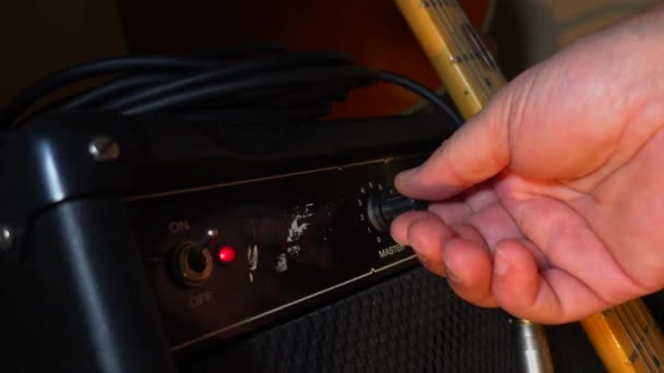 Musician Adjusts Guitar Amp — Stock Video