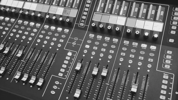 sound mixing console closeup . Black and white